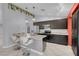 Open kitchen with stainless appliances, granite countertops, and a breakfast bar with seating at 4644 Canna Dr, Las Vegas, NV 89122