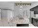 Kitchen with granite counters, stainless appliances, breakfast bar, and an open layout at 4644 Canna Dr, Las Vegas, NV 89122
