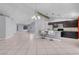 Open concept kitchen with stainless appliances, granite countertops, and a breakfast bar with seating at 4644 Canna Dr, Las Vegas, NV 89122