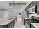Kitchen featuring stainless steel appliances, granite countertops and an open concept layout at 4644 Canna Dr, Las Vegas, NV 89122