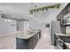 Bright kitchen with stainless appliances, granite counters, breakfast bar and an open concept layout at 4644 Canna Dr, Las Vegas, NV 89122