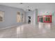 Bright, open-concept living area with tile flooring and natural light at 4644 Canna Dr, Las Vegas, NV 89122