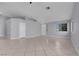 Spacious living area featuring tile floors, a ceiling fan, and neutral color scheme at 4644 Canna Dr, Las Vegas, NV 89122