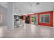 Open living space with breakfast bar, pendant lighting, and access to backyard at 4644 Canna Dr, Las Vegas, NV 89122