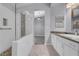 Bathroom with walk-in shower, double sinks, and view to the main bedroom at 4644 Canna Dr, Las Vegas, NV 89122