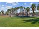Community playground with colorful equipment and lush landscaping, creating a fun and safe environment for children at 4644 Canna Dr, Las Vegas, NV 89122