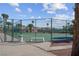 Community tennis court surrounded by mature trees, providing a great opportunity for recreation and fitness at 4644 Canna Dr, Las Vegas, NV 89122