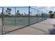 View of the community tennis and basketball court surrounded by a chain link fence at 4644 Canna Dr, Las Vegas, NV 89122