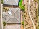This home's aerial view displays a gray roof, tidy landscaping, and desert landscaping at 4893 E Cedar Creek Way, Pahrump, NV 89061