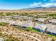 An aerial view captures the neighborhood's layout, mountain backdrop, and desert surroundings at 4893 E Cedar Creek Way, Pahrump, NV 89061