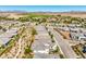 Picturesque aerial view of a well-maintained residential community with beautiful homes and desert landscaping at 4893 E Cedar Creek Way, Pahrump, NV 89061
