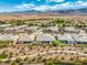 Picturesque aerial showing homes with desert landscaping and mountain backdrops at 4893 E Cedar Creek Way, Pahrump, NV 89061