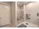 Clean bathroom featuring a glass door shower, tiled flooring, and modern fixtures at 4893 E Cedar Creek Way, Pahrump, NV 89061
