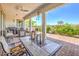 Relaxing covered patio with comfortable seating, ceiling fan, BBQ, and an open view of the outdoors at 4893 E Cedar Creek Way, Pahrump, NV 89061