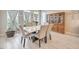 The dining room features modern lighting, a marble dining table, and comfortable seating at 4893 E Cedar Creek Way, Pahrump, NV 89061