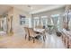 Bright dining room with tile floors, chandelier, and lots of natural light at 4893 E Cedar Creek Way, Pahrump, NV 89061