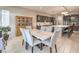 Elegant dining room with modern light fixtures and seating at island at 4893 E Cedar Creek Way, Pahrump, NV 89061