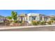 Beautiful single-story home featuring a well-manicured front yard and neutral color palette at 4893 E Cedar Creek Way, Pahrump, NV 89061