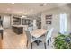 Bright, open-concept kitchen with modern appliances and dining area at 4893 E Cedar Creek Way, Pahrump, NV 89061