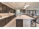 Spacious kitchen with a long island, bar seating, and dark wood cabinetry at 4893 E Cedar Creek Way, Pahrump, NV 89061