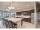 Modern kitchen with white countertops, stainless steel appliances, and ample cabinet space at 4893 E Cedar Creek Way, Pahrump, NV 89061