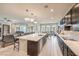 Bright, open kitchen with a large center island, modern lighting, and stainless appliances at 4893 E Cedar Creek Way, Pahrump, NV 89061