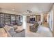 Large living room with book cases and comfortable seating arrangement at 4893 E Cedar Creek Way, Pahrump, NV 89061