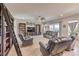Open living room with tile floors, media center, and comfortable sofas at 4893 E Cedar Creek Way, Pahrump, NV 89061