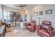 Home office with ceiling fan, rolling chair, and ample shelving at 4893 E Cedar Creek Way, Pahrump, NV 89061