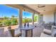 An outdoor patio has comfortable seating arrangements and a view of the backyard greenery at 4893 E Cedar Creek Way, Pahrump, NV 89061