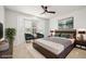 Bright bedroom with a bay window, a contemporary platform bed, and stylish furnishings for a serene retreat at 5067 Pensier St, Las Vegas, NV 89135