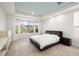 Bright bedroom with a large window offering scenic views, a modern bed, and sleek furnishings at 5067 Pensier St, Las Vegas, NV 89135