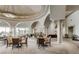 Elegant clubhouse featuring soaring ceilings, arched windows, and ample seating for residents at 5067 Pensier St, Las Vegas, NV 89135