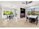 Open-concept dining area featuring views of a landscaped yard and golf course at 5067 Pensier St, Las Vegas, NV 89135