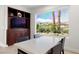 Cozy dining area with built-in storage, a large window with a scenic view, and ample natural light at 5067 Pensier St, Las Vegas, NV 89135