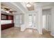 Welcoming entryway with custom built-ins, a tiled floor, and ample natural light at 5067 Pensier St, Las Vegas, NV 89135