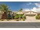 Charming single-story home with desert landscaping and a well-maintained two car garage at 5067 Pensier St, Las Vegas, NV 89135
