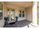 Inviting front porch with tiled flooring, a decorative glass front door, and ample natural light at 5067 Pensier St, Las Vegas, NV 89135