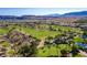 Scenic golf course view with meticulously manicured greens surrounded by desert landscaping and mountain views at 5067 Pensier St, Las Vegas, NV 89135