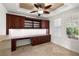 Stylish home office with custom built-ins, desk, and ample natural light for a productive workspace at 5067 Pensier St, Las Vegas, NV 89135
