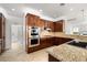 Well-equipped kitchen featuring stainless steel appliances and granite countertops with plenty of counter space at 5067 Pensier St, Las Vegas, NV 89135