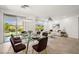 Open concept featuring a dining area and a bright, airy living room with seamless indoor-outdoor living at 5067 Pensier St, Las Vegas, NV 89135