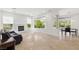 Open living space with fireplace, picture windows, and seamless flow to outdoor dining at 5067 Pensier St, Las Vegas, NV 89135