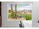 Scenic view from the dining area showcasing the lush landscaping and the surrounding community, offering a tranquil ambiance at 5067 Pensier St, Las Vegas, NV 89135