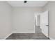 Cozy bedroom with ceiling fan, modern gray flooring, and neutral paint throughout at 5213 Giallo Vista Ct, North Las Vegas, NV 89031