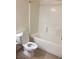 Bathroom featuring a toilet with the lid open next to a white bathtub at 5655 E Sahara Ave # 1037, Las Vegas, NV 89142