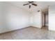 Minimalist bedroom featuring tile floors, ceiling fan, and a neutral color palette at 5655 E Sahara Ave # 1037, Las Vegas, NV 89142