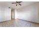 An airy bedroom featuring neutral tile flooring and a ceiling fan for added comfort at 5655 E Sahara Ave # 1037, Las Vegas, NV 89142