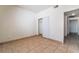 Bedroom featuring neutral tile flooring and a closet for added storage at 5655 E Sahara Ave # 1037, Las Vegas, NV 89142