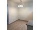 The dining area has tile floors and a simple chandelier at 5655 E Sahara Ave # 1037, Las Vegas, NV 89142